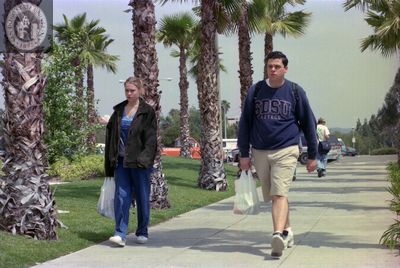 Students on a walkway near a street, 1999