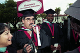 Advanced-degree graduates in caps and gowns, 1999