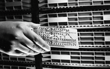 Woman's hand holds circuit board