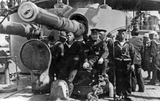 Cannons and crew on a battleship