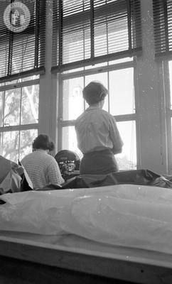 Students at window in typing laboratory