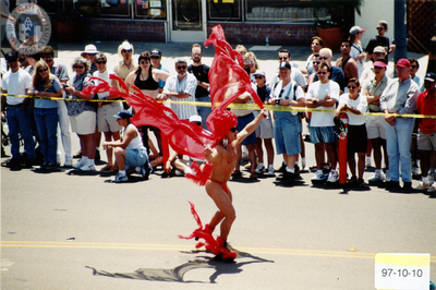 Marcher in red bird costume at Pride parade, 1997