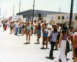 Marchers and "Paper bag brigade" banner at Pride parade, 1978