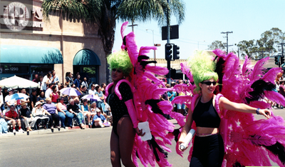 Marchers with feather costumes at Pride parade, 1997
