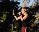 Performer with a microphone at Pride Festival, 2002