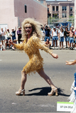 Marcher in gold dress at Pride parade, 1997