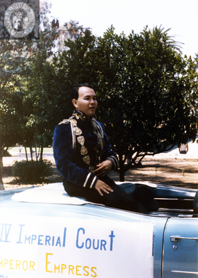 Nicole Murray Ramirez sitting on Imperial court car in Pride parade, 1985