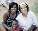 Adults and child at Pride Festival, 1998