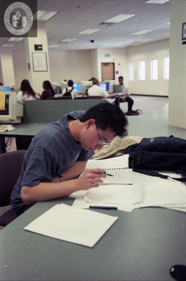 Student studies in library, 1998