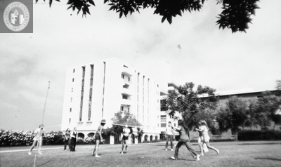Students play volleyball near Zura Hall