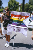 Pride parade marcher holds flag with 1988 Pride theme, 1992