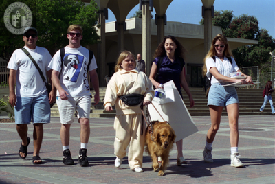 Woman with guide dog and other students, 1996