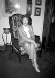 Joyce Oliver sits in chair