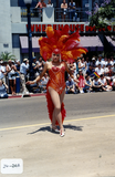 Marcher in showgirl costume in Pride parade, 2000