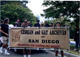 James Burnette and Lori Kaye hold banner at Pride parade, 1990