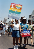 Marchers with signs at the Pride parade, 1996