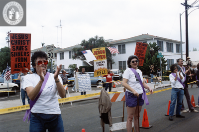 Religious protestors stand with traffic cones on Pride Parade route, 1991