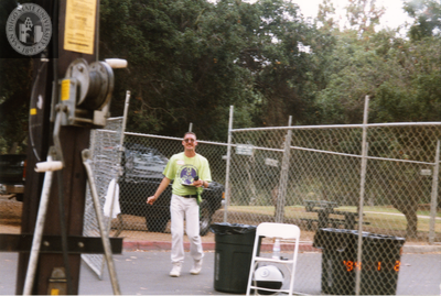 Gary walking out of fenced area at Pride festival, 1998