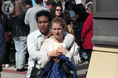 Couple watches something out of frame, 1998