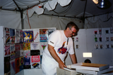 Doug Moore sets up Lesbian and Gay Historical Society tent, 1994