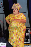 Drag queen performer with flower dress at Pride Festival, 1999