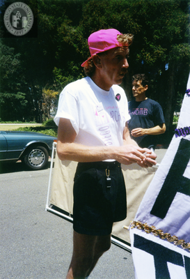 Lesbian and Gay Archives of San Diego volunteer touches up a flag, 1992