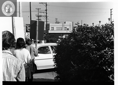 Picketers wait for a car to pass during Gay Liberation Front picket at SDPD, 1971