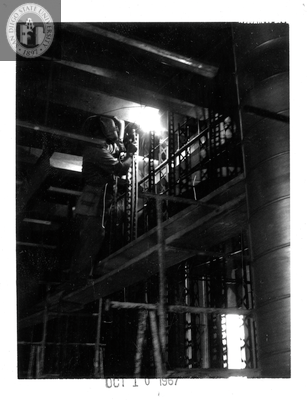 Welding steel lath, Aztec Center construction site, 1967