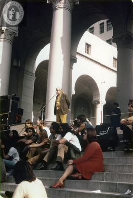 Man speaks into microphone at antiwar protest at Los Angeles City Hall, 1971