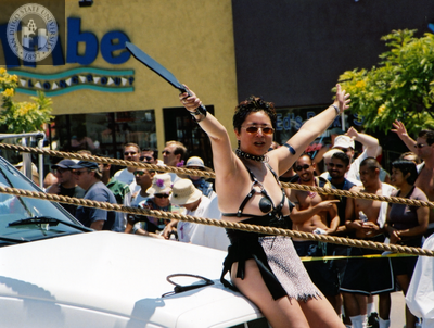 Woman in leather costume in Pride parade, 2001