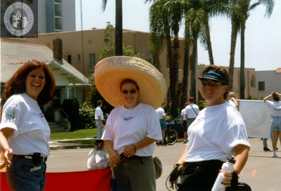 Center volunteers pose together while in Pride parade, 1998