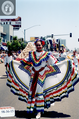 Marcher wearing rainbow dress in Pride parade, 1998