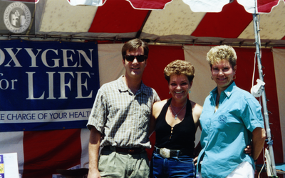Renne Rhae at the Oxygen for Life booth at San Diego Pride, 1995 