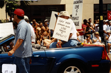 "Gay Kids Straight Kids Love Makes a Family!!" sign in Pride parade, 2000