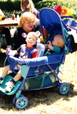 Person with children in stroller at For the Children, 1996