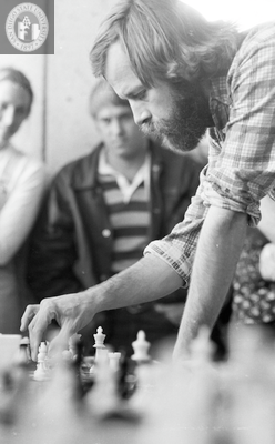 Jim Macki plays 5 separate chess games, 1975