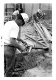 Construction worker welds a roof drain, 1967