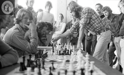 Jim Macki plays chess outside Love Library, 1975