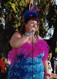 Candye Kane in feathers at Pride Festival, 2002