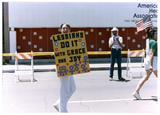 Diane Germain's "Lesbians Do It With Grace and Joy" sign at Pride parade, 1988