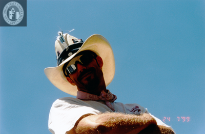 Man wearing hat at Pride parade, 1999