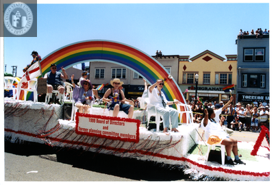 Rainbow float with board and committee members, Pride parade, 1999