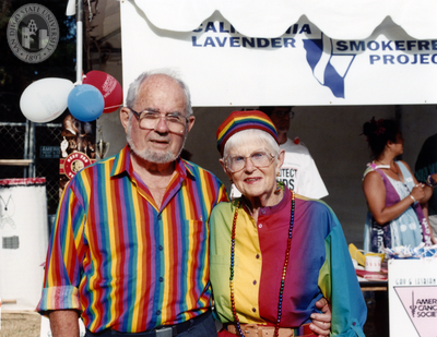 Man and woman wearing rainbow garb at Pride Festival, 1998