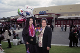 Graduate with mother and balloons, 1999