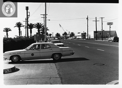 San Diego Police car drives past picketers from Gay Liberation Front, 1971
