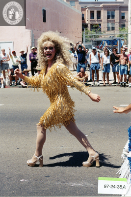 Marcher in gold dress at Pride parade, 1997