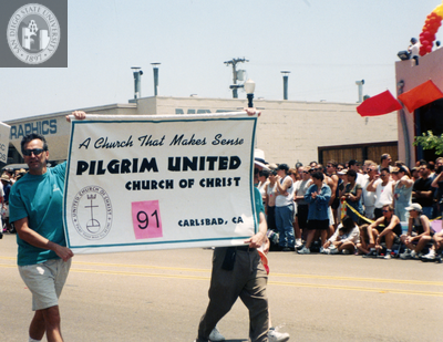 Pilgrim United Church of Christ banner at Pride parade, 1998
