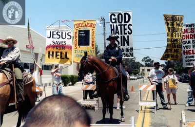 Protesters behind police on horseback, 1999