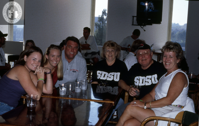 Family at a table on Family Weekend, 2000