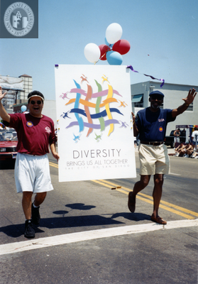 Men with sign "Diversity Brings Us All Together" at Pride parade, 1996